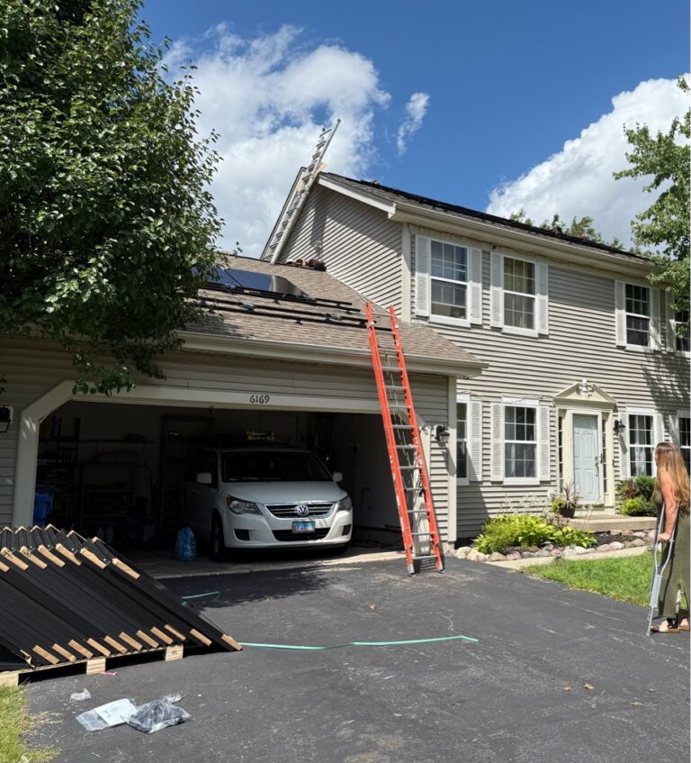 MSI crew installing PV system on residential home in Illinois with ladders and equipment visible