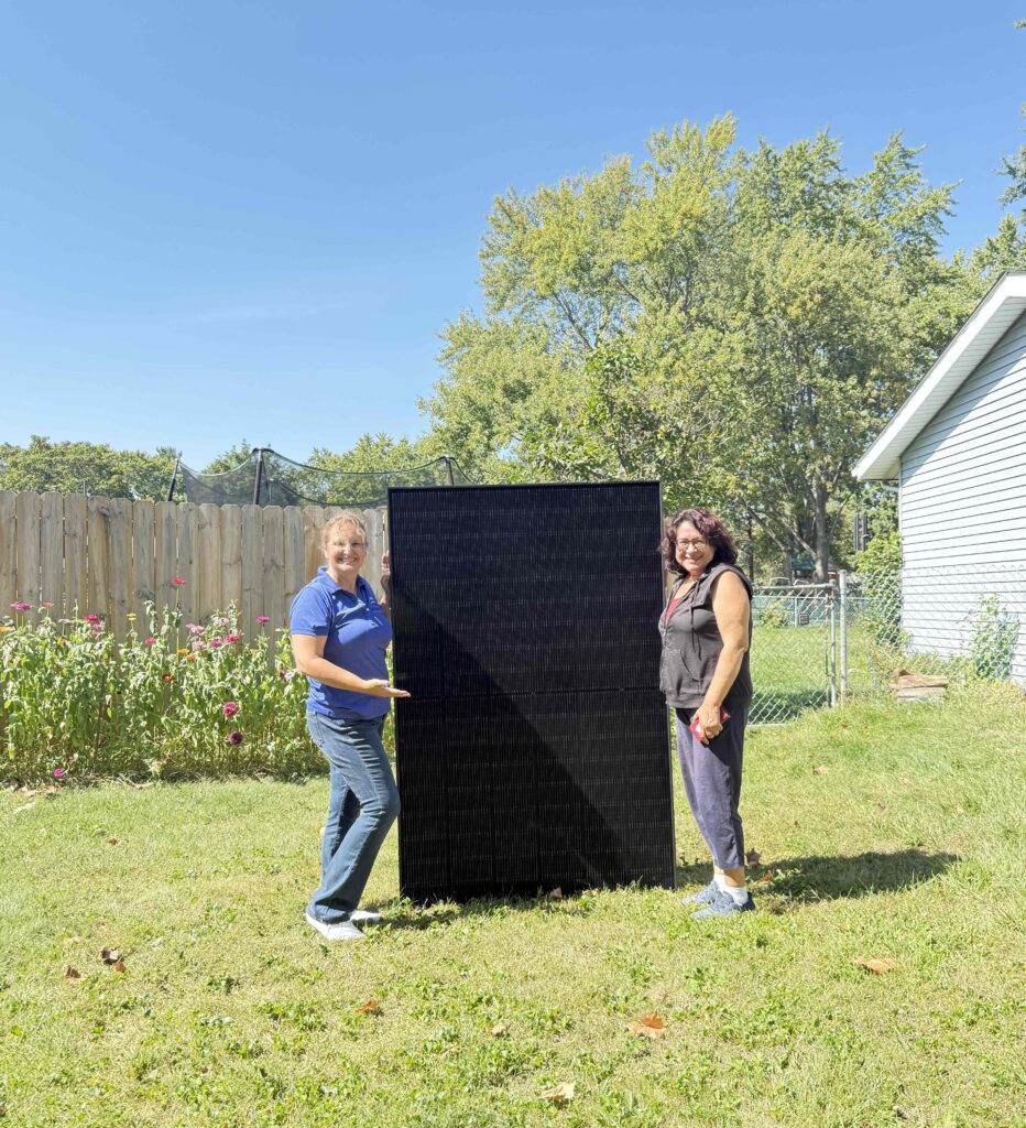 MSI sales rep and happy homeowner with solar panel